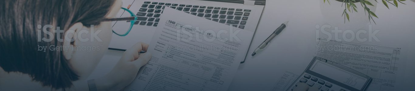 paperwork in front of laptop keyboard