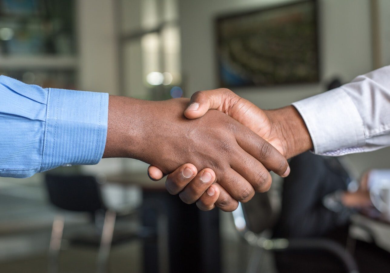 men-shake-hands-in-office